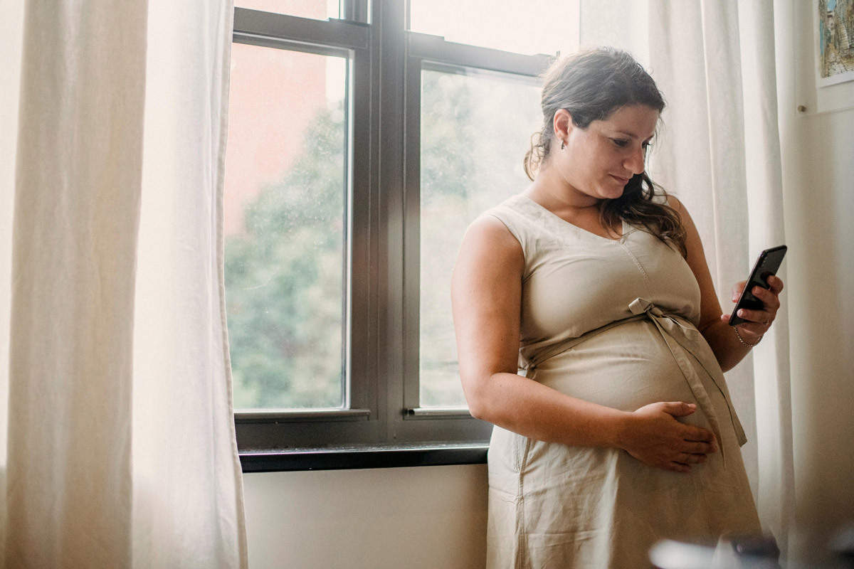 Pregnant woman using phone